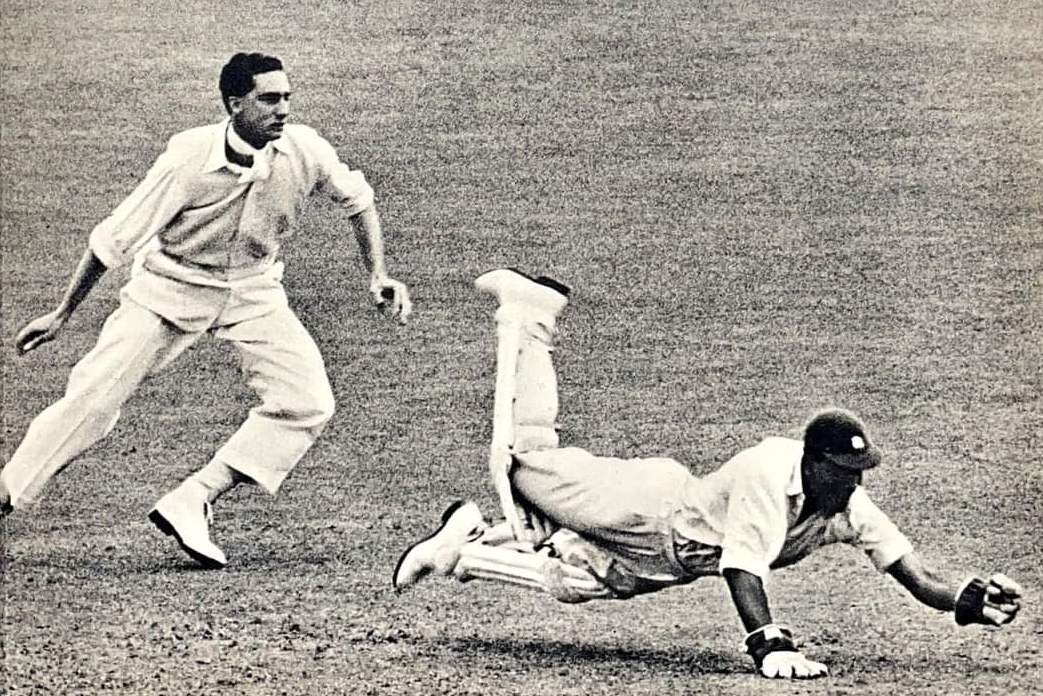 CL Walcott makes a spectacular save in the Trent Bridge Test, 195o. On the left is H.B.Stollmeyer